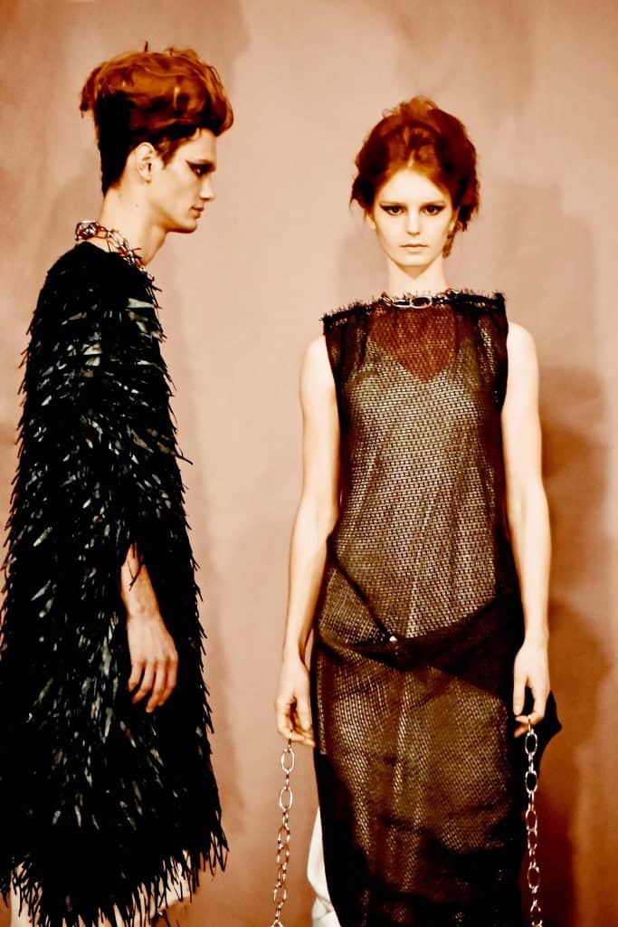 Sustainable luxury gender neutral couture designer Italian wool burlaps and sustainable leather feather dress