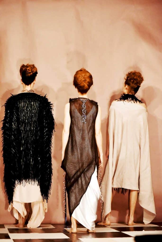 Sustainable luxury genderless sustainable leather feather, Italian wool burlaps and linen dresses