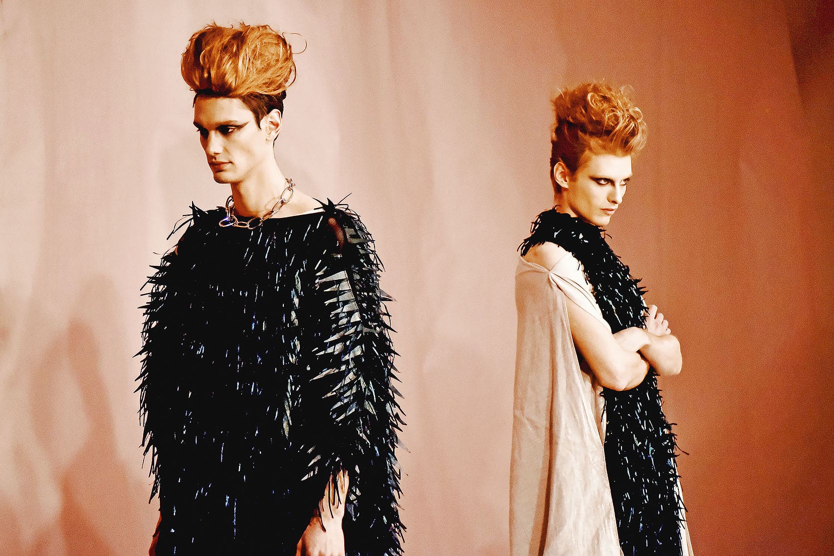 Men's couture feather tunic and layered dress with sustainable leather